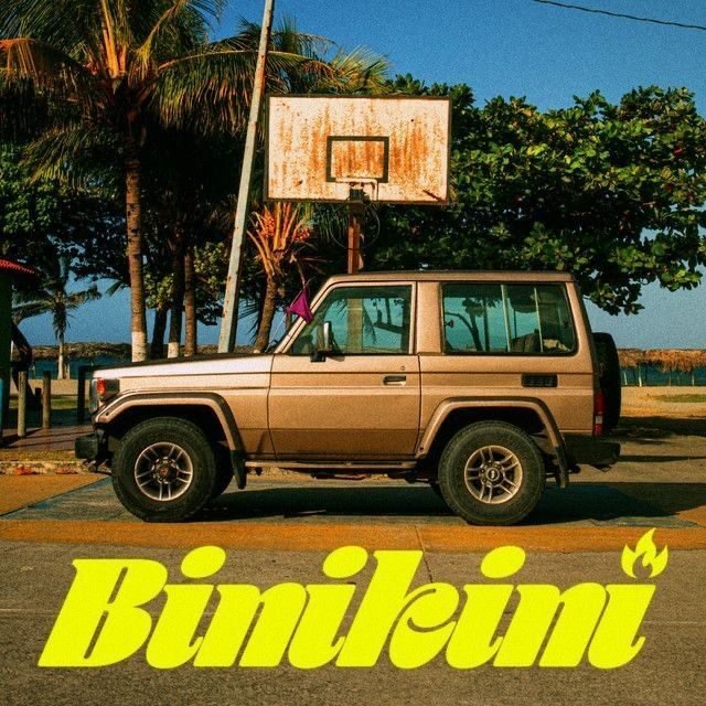 “Binikini” single cover: a beige off-road truck parked under a rusted basketball hoop by the sea.